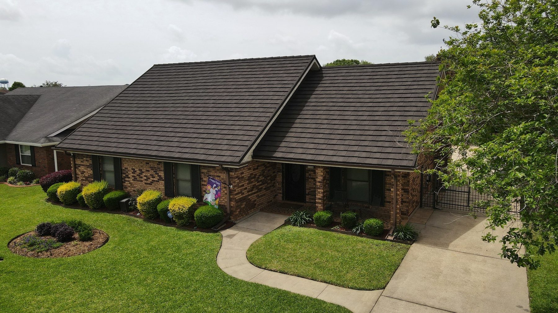 Stone-coated steel roof on a single-story brick home